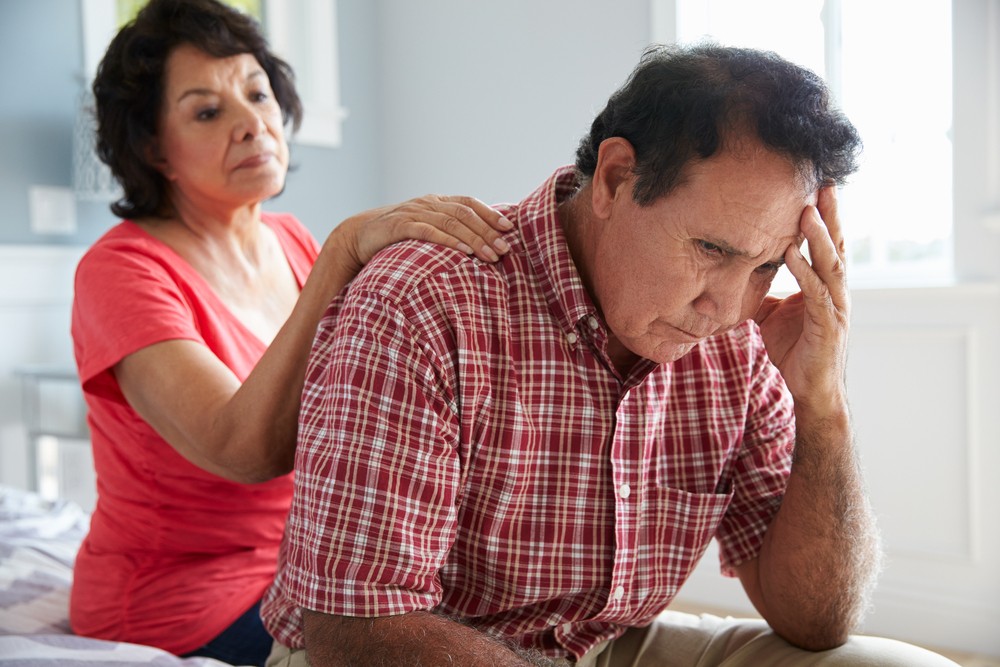 Senior man with dementia being comforted