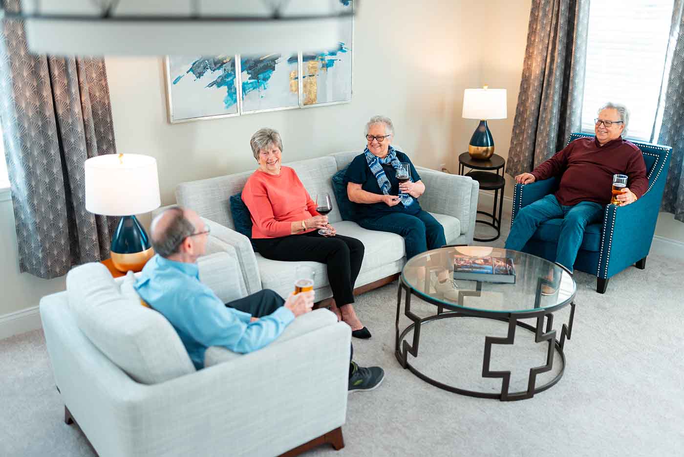 A senior group meets inside a living room